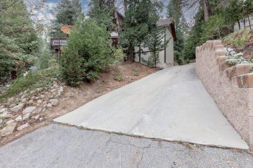 a driveway leading up to a home with a house at Hillside Hideaway - game rm - master spa - Luxury in Lake Arrowhead