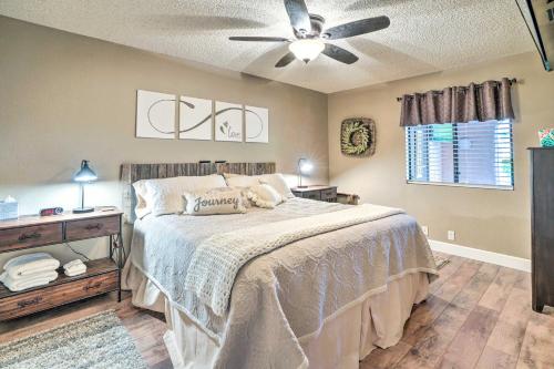 a bedroom with a bed and a ceiling fan at Peoria Oasis with Resort Amenities, 2 Mi to Downtown in Peoria