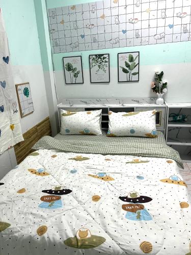a bedroom with a bed with a hello kitty comforter at Baan Busaya บ้านบุษยา in Ban Khlong Phutsa