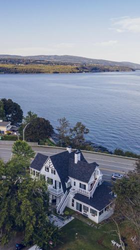 an aerial view of a large house by the water at Auberge La Marmite in La Malbaie