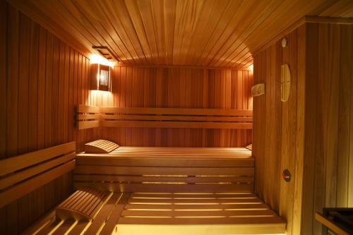a wooden sauna with two beds in it at Hotel SPA Dr Irena Eris Polanica Zdrój in Polanica-Zdrój
