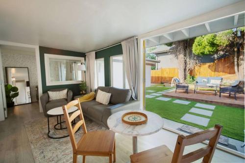 a living room with a couch and a table at King Garden Suite/20 mins to Dwntwn Vancouvr/PetOk in North Vancouver