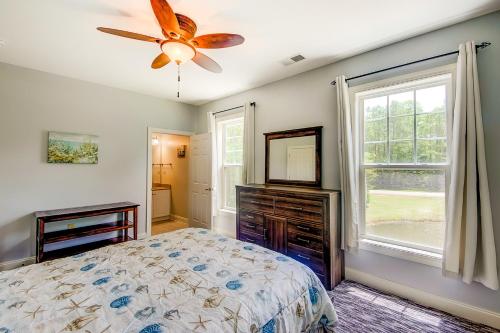a bedroom with a bed and a ceiling fan at World Tour 206 in Myrtle Beach