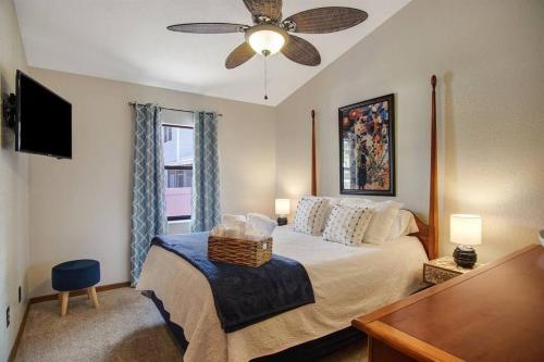 a bedroom with a bed and a ceiling fan at Family Friendly Pool Paradise Retreat Near Beaches in Palm Harbor