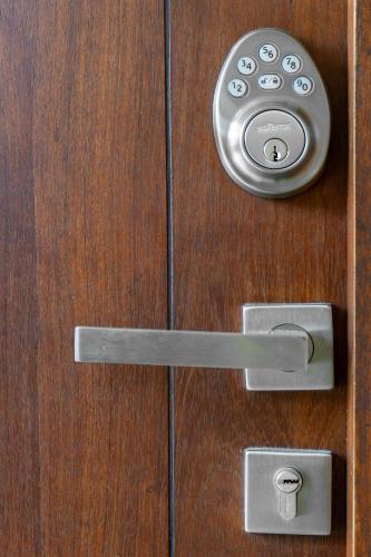 a wooden door with a door knob and a door knocker at Modern Studio Pool Access Near Downtown A105 in Tulum