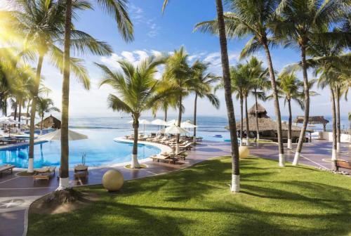 a view of the pool at the excellence punta cana resort at Condo at Krystal Grand Resort in Bucerías