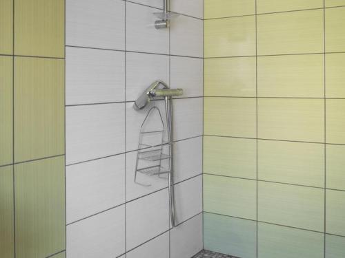 a shower with a hose on a wall at Gîte Saint-Bonnet-de-Rochefort, 3 pièces, 5 personnes - FR-1-489-181 in Saint-Bonnet-de-Rochefort