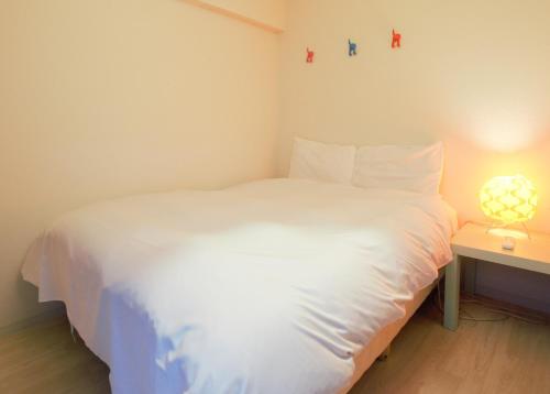 En eller flere senge i et værelse på Nippombashi kaikan 601