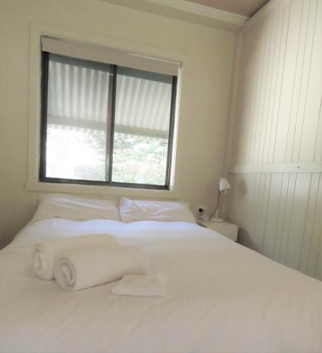 Ένα ή περισσότερα κρεβάτια σε δωμάτιο στο Beechworth Holiday Park