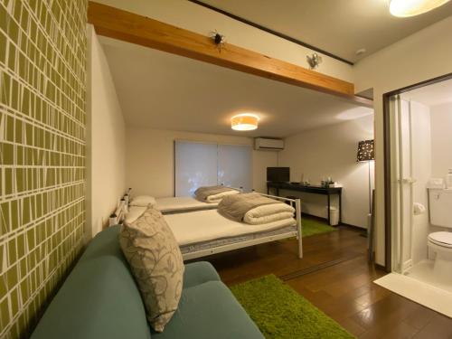 Ένα ή περισσότερα κρεβάτια σε δωμάτιο στο Bamboo Village Guest House