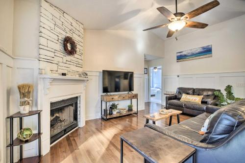 a living room with a couch and a fireplace at Idyllic Pinehurst Home, Near Golf Course! in Pinehurst