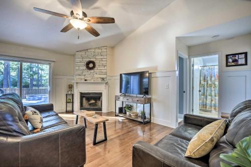 a living room with a couch and a fireplace at Idyllic Pinehurst Home, Near Golf Course! in Pinehurst