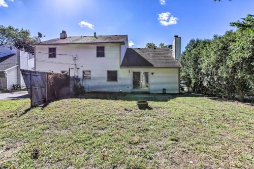 an empty yard in front of a white house at 5 Mi to UT Quiet Toledo Duplex Near Parks! in Toledo