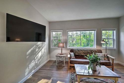 a living room with a couch and a flat screen tv at Near Sugar Mtn Resort! Mtn-View Outdoor Basecamp in Banner Elk