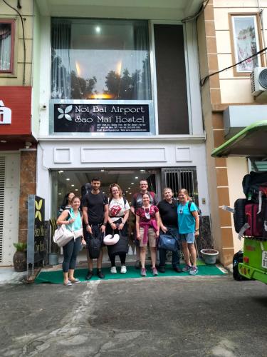 a group of people standing outside of a building at Sao Mai Cosy Nest-Noi Bai Airport in Thach Loi
