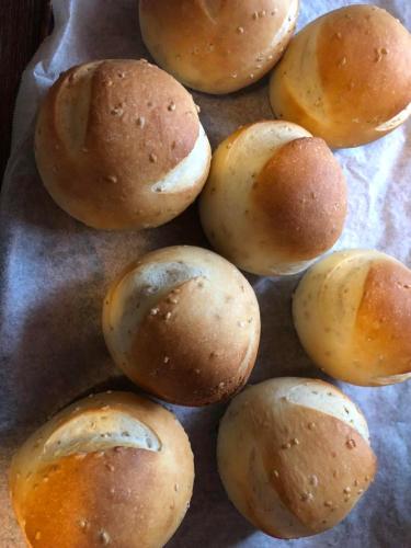 a pile of buns sitting on a baking sheet at 島宿糸 in Iki