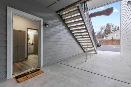 a sliding glass door to a garage with a staircase at Full ADA Unit - 2 Bed 2 Bath Unit Near Downtown in Spokane
