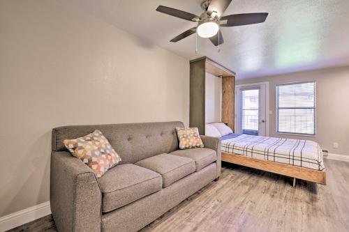 a living room with a couch and a bed at Cozy Studio with Balcony, Walk to Brian Head Resort! in Brian Head