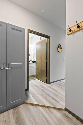an open door in a room with a kitchen at Full ADA Unit - 2 Bed 2 Bath Unit Near Downtown in Spokane