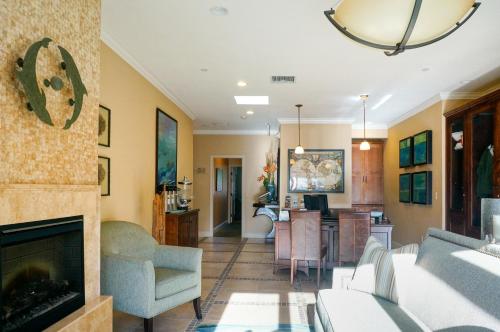 a living room with a couch and a fireplace at Blue Dolphin Inn in Cambria