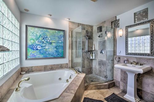 a bathroom with a tub and a sink at Carlsbad Getaway - Furnished Patio and Pool! in Carlsbad