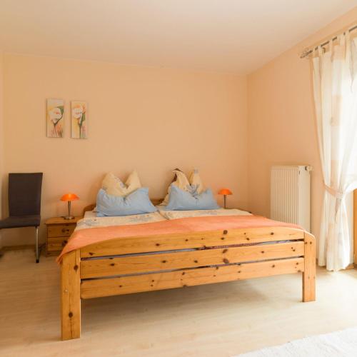 Llit o llits en una habitació de Ferienwohnung Meisbüsch