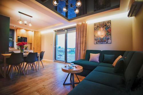 a living room with a couch and a table at Na Skraju Raju in Zator