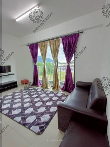 a living room with purple curtains and a couch at Nana Homestay Malay Only in Kampong Chepor