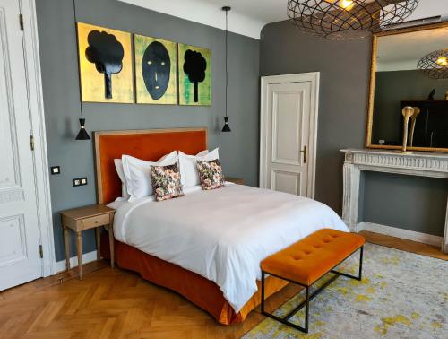 a bedroom with a large bed and a fireplace at The Old Beech in Antwerp