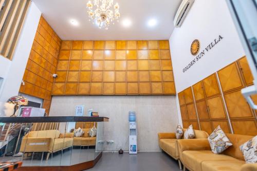 a store lobby with couches and a chandelier at Hanoi Golden Sunshine Villa Hotel and Travel in Hanoi