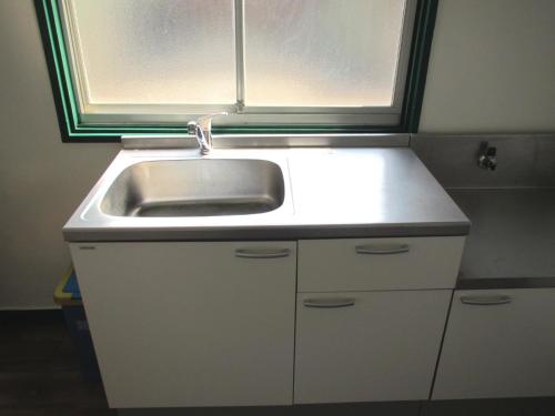 a sink and a window in a small kitchen at Fukuoka - House / Vacation STAY 4617 in Fukuoka