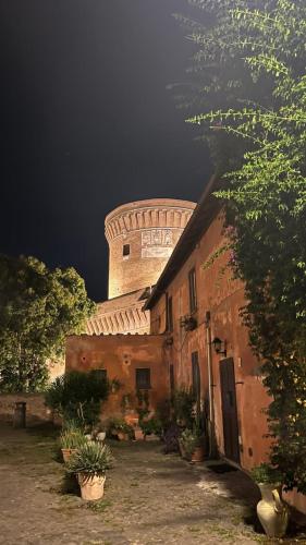 a building with a tower on top of it at Domus Lido in Lido di Ostia