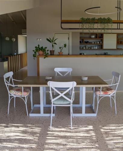 a table and two chairs sitting around a table at Callisto Seaside Homes & Suites in Marathopolis