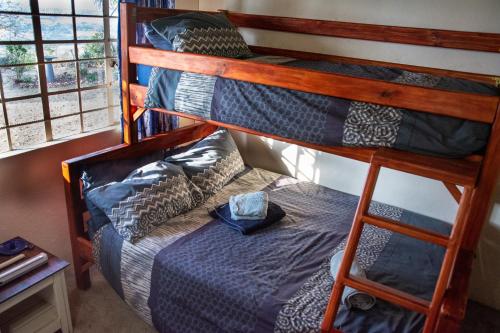 Ένα ή περισσότερα κρεβάτια σε δωμάτιο στο OPPIBERG GUEST HOUSE and SPA