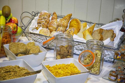 a table topped with bowls of different types of food at Torc Hotel in Killarney