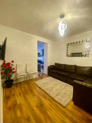 a living room with a couch and a rug at House near Cardiff City Centre in Cardiff