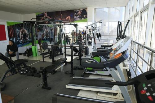 a gym with a bunch of tread machines at Hotel Cristal Madagascar in Antananarivo