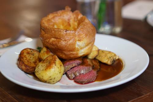 a plate of food with a croissant and a pastry at Chapter House in Salisbury