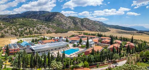 an aerial view of a resort in the mountains at Spa Hotel Colossae Thermal in Pamukkale