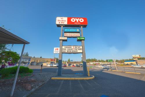 a gas station sign on the side of a road at OYO Hotel St Helens OR in Saint Helens