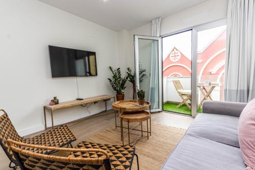 TV a/nebo společenská místnost v ubytování Hola Beach Suite
