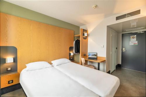 Postel nebo postele na pokoji v ubytování B&B HOTEL Lyon Sud États-Unis