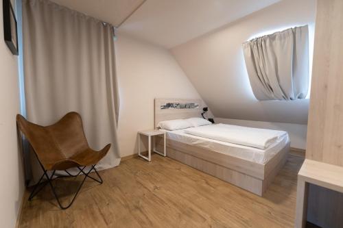 Postel nebo postele na pokoji v ubytování Hotel Arena Maribor