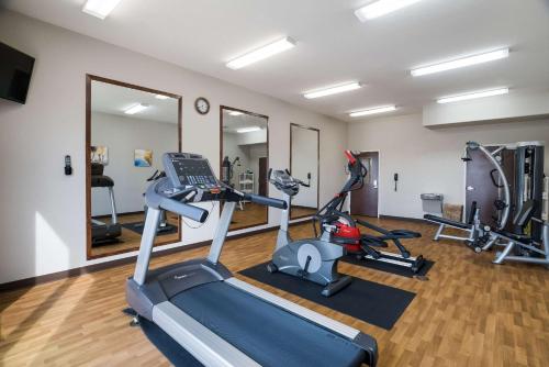 a gym with two tread machines and a treadmill at Comfort Inn & Suites Victoria North in Victoria