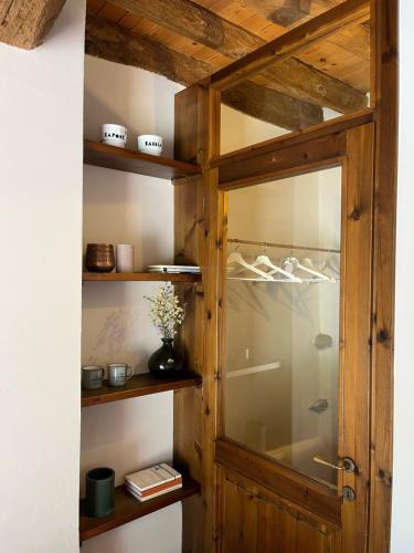 a wooden door with a glass window in a room at Agriturismo Rio Verde in Sasso Marconi