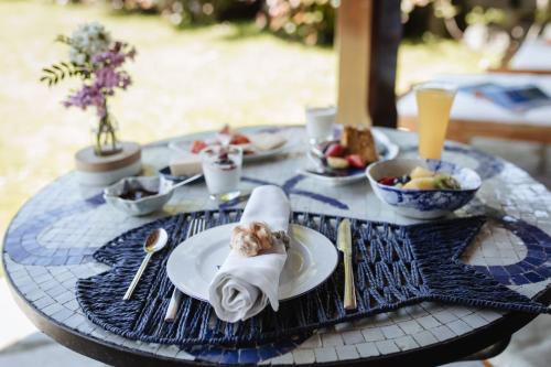 a table with a plate of food on top at Hotel Pleamar in Puerto de Vega