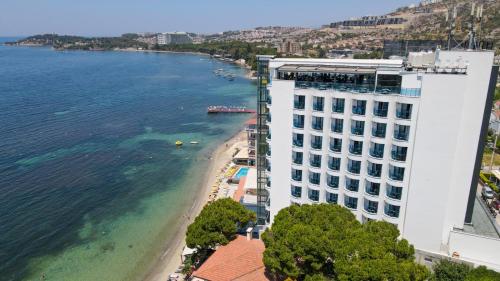 an aerial view of a beach next to a building at SIGNATURE BLUE RESORT in Kusadası
