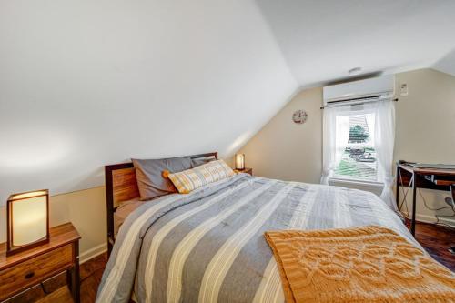 a bedroom with a large bed and a window at Cozy Chalet Bungalow in Westpark/Cleveland in Cleveland