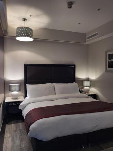 Postel nebo postele na pokoji v ubytování Ambassador, a Boutique Hotel