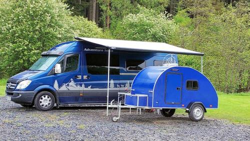 a blue truck with a tent on top of it at Darwin Teardrop Caravan for Hire from ElectricExplorers in Hawkshead